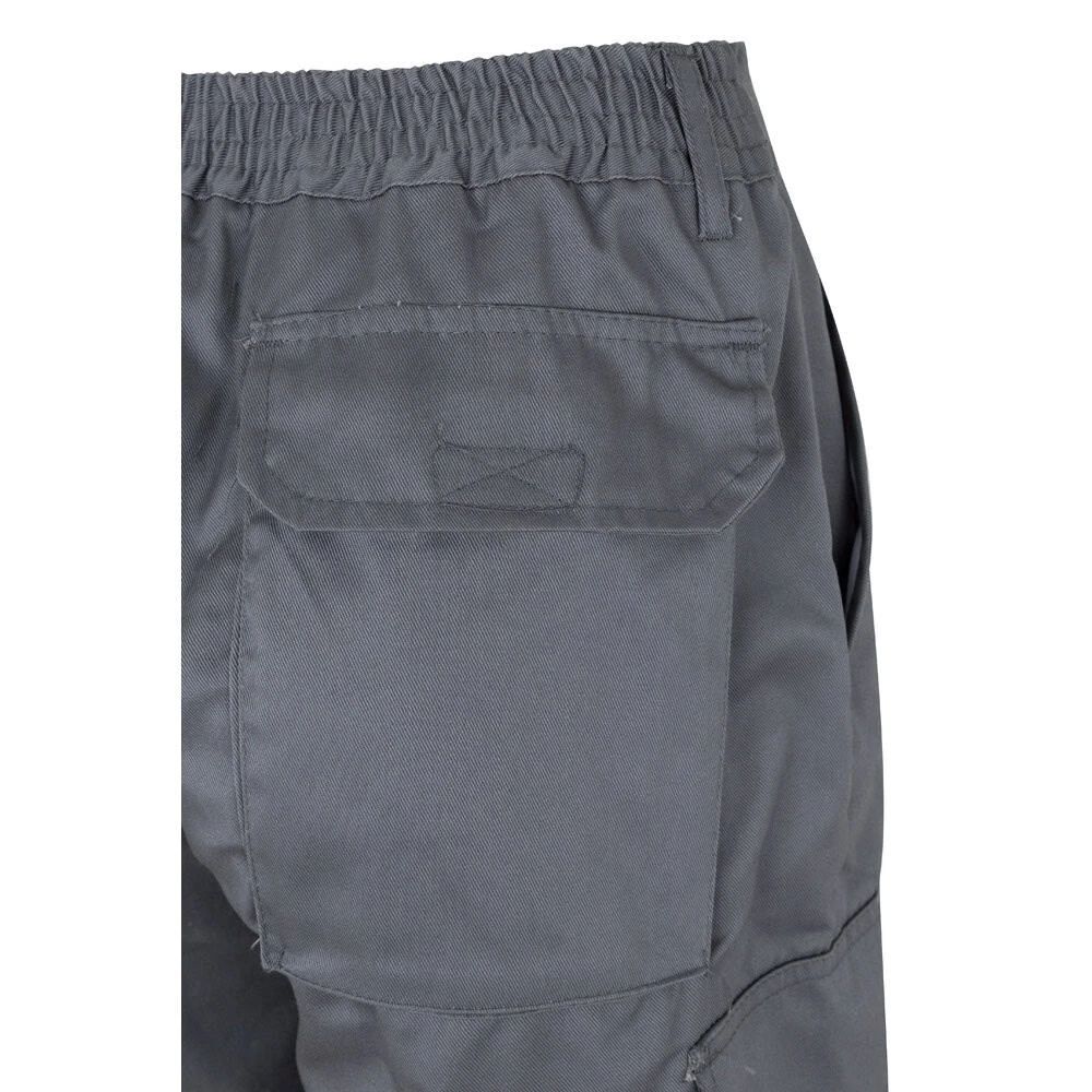 Tvåfärgade byxor i twill med fickor, bomull och polyester.