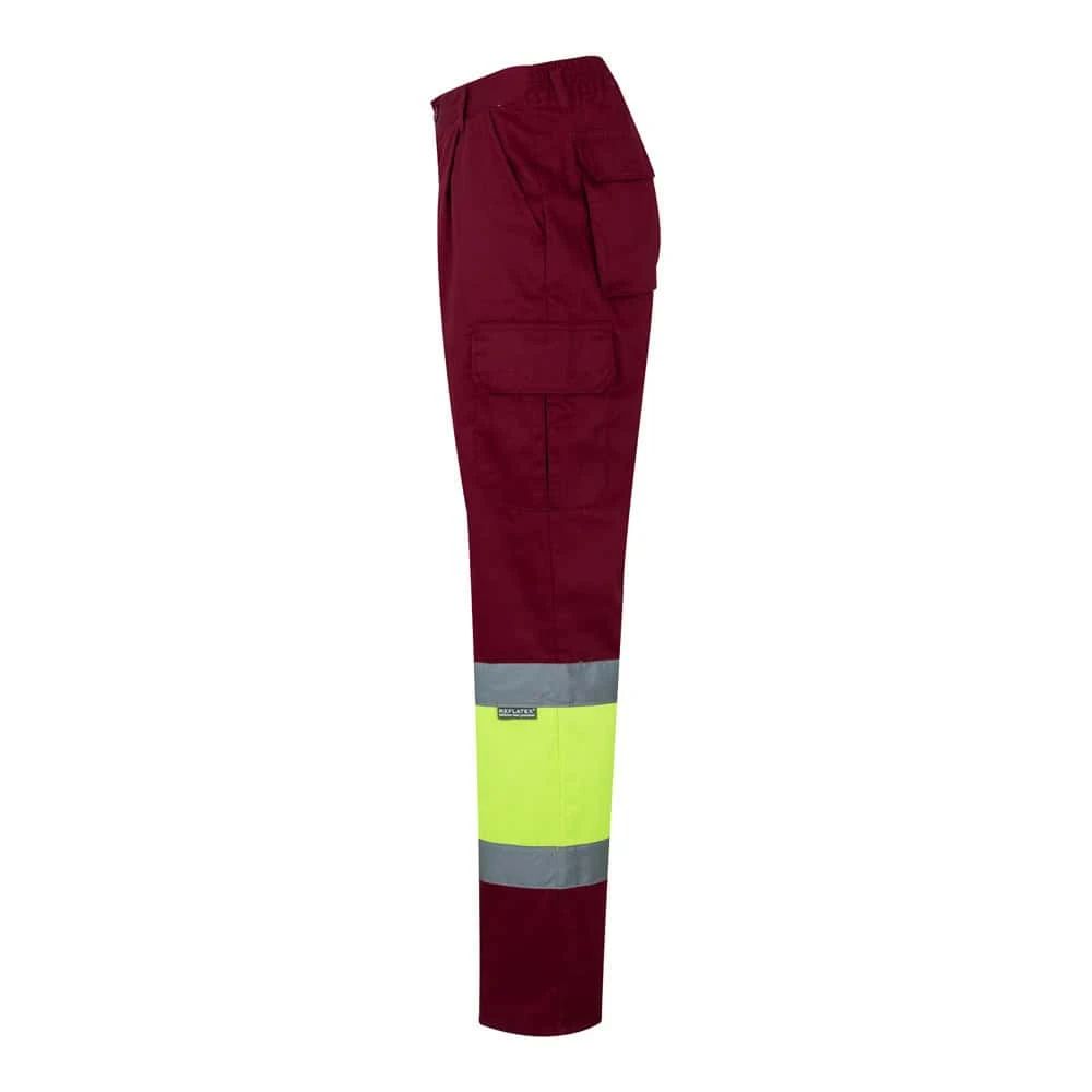 Tvåfärgade arbetsbyxor i twill med fickor, reflexdetaljer, i bomull och polyester.