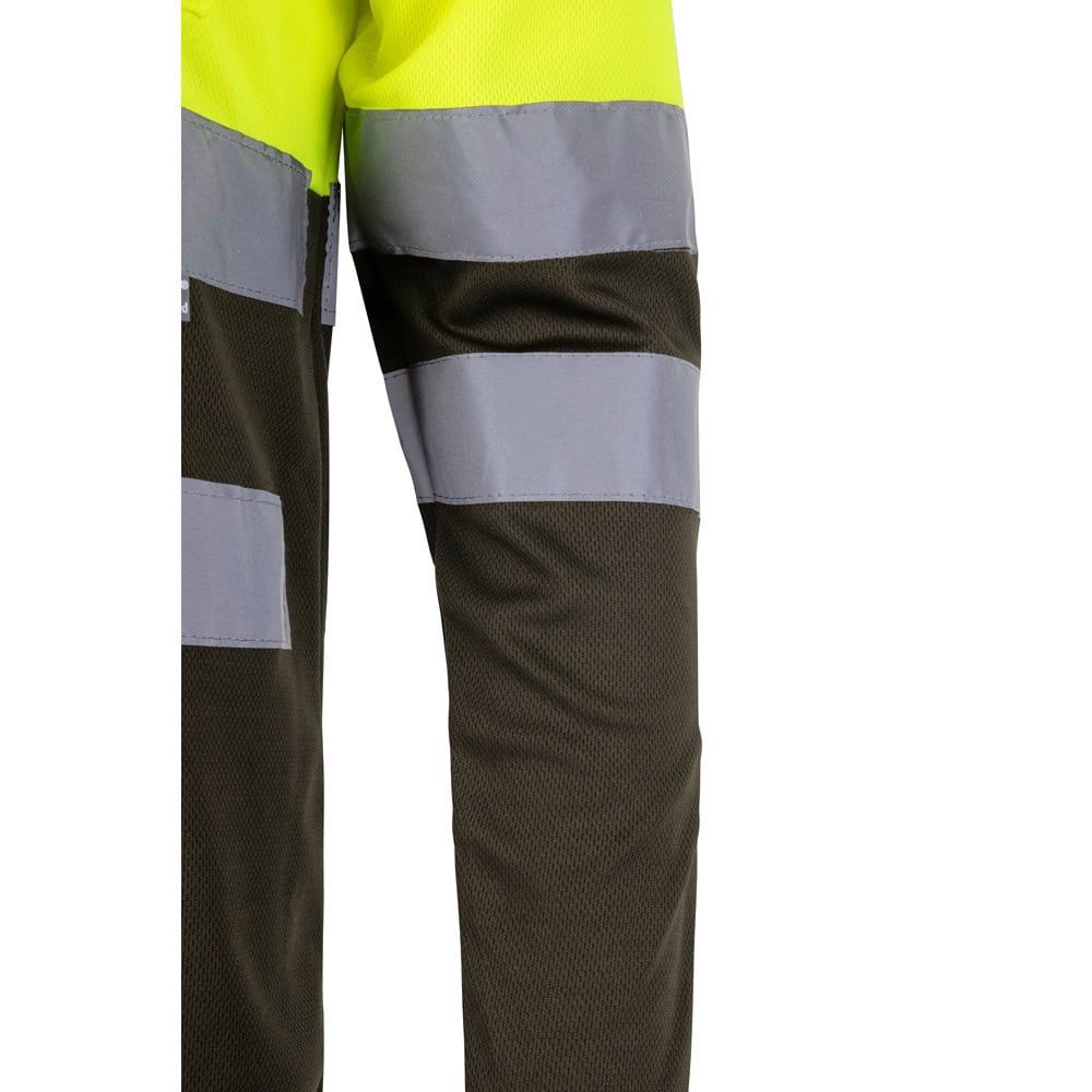 Tvåfärgad pikétröja i polyester med fågelögonmönster och hög synlighet.