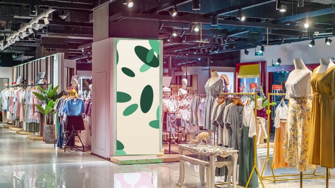 Väggmonterad ljuslåda med tryck i en butik
